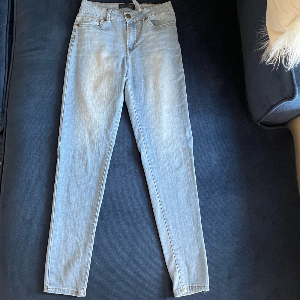 Light wash Skinny Jean! Small tear shown in last picture.